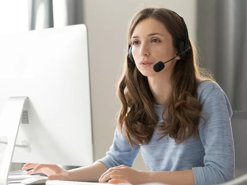 Online salesperson talking on a headset