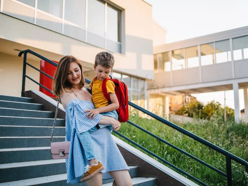 Mother picking up her son from the school