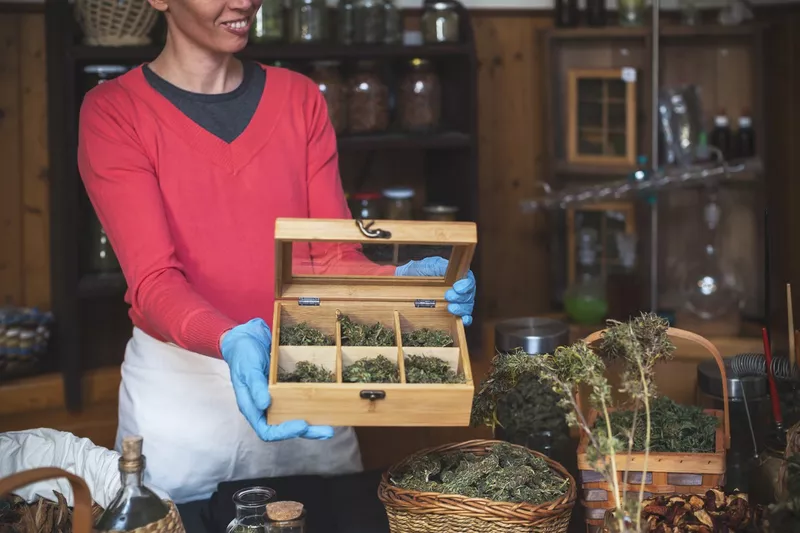 Woman with box of weed