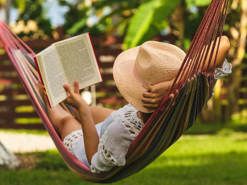 Woman relaxing in a hammock