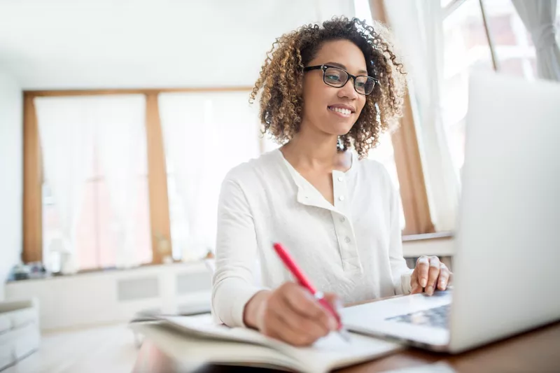 Young businesswoman working at home