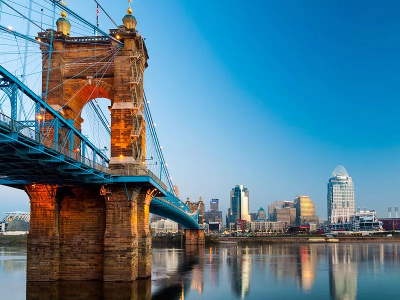 Cincinnati skyline and Roebling Suspension Bridge at dawn