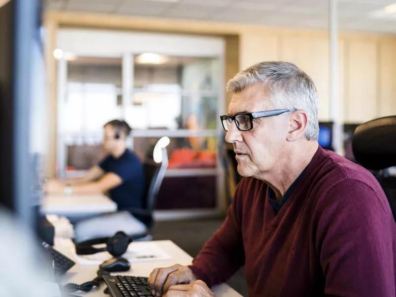 Older man working at computer