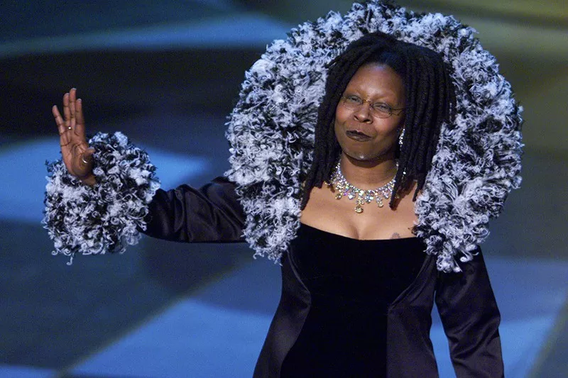 Whoopi Goldberg waving