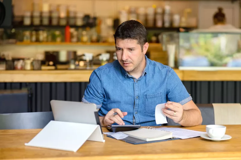 Man doing work on tablet