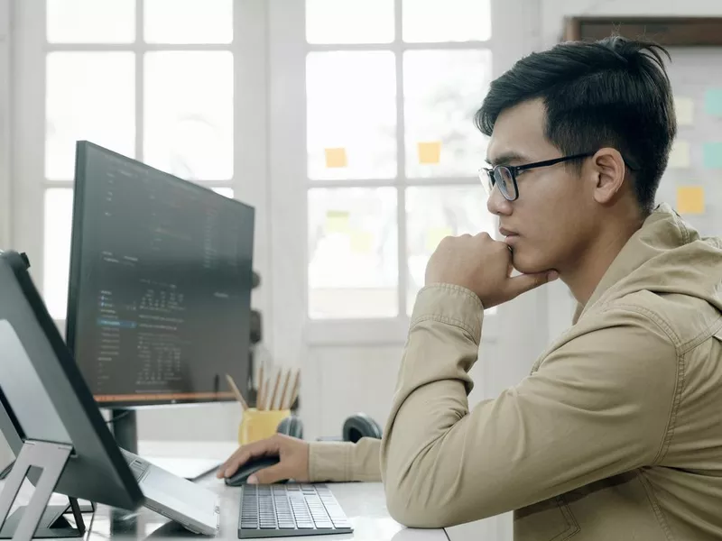 Website tester looking at his computer screen