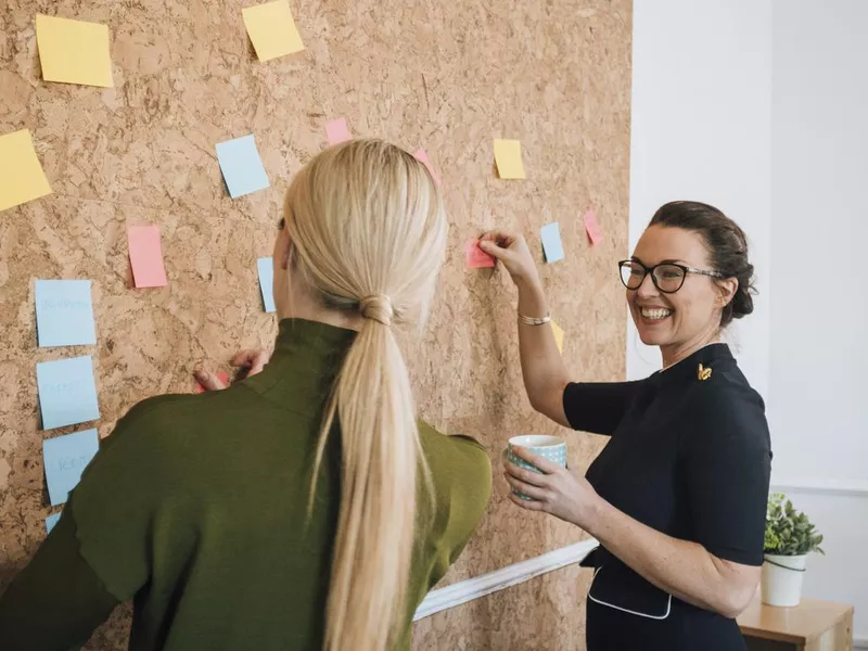 Women making business notes