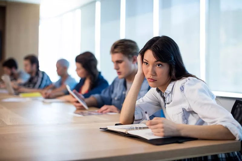 Bored woman at meeting