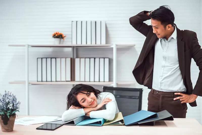 Woman sleeping at work