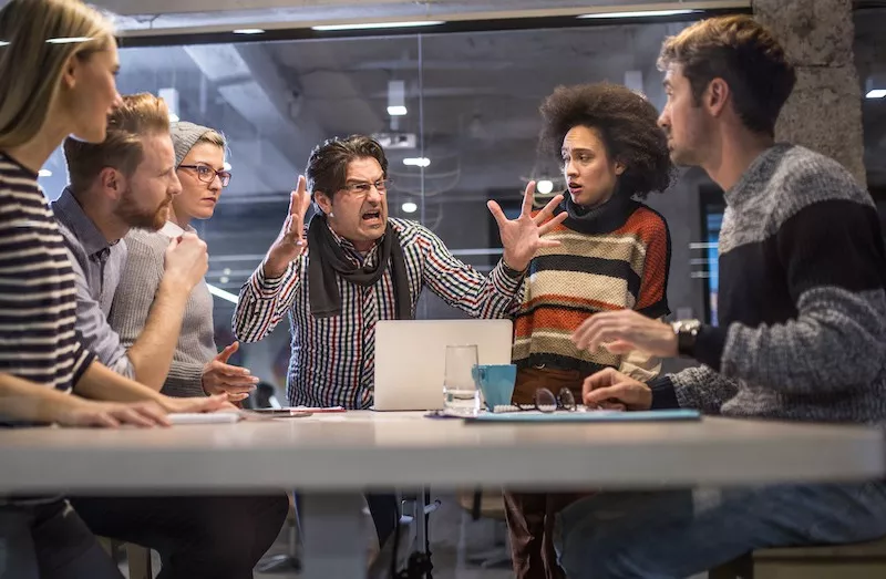 Upset boss at team meeting