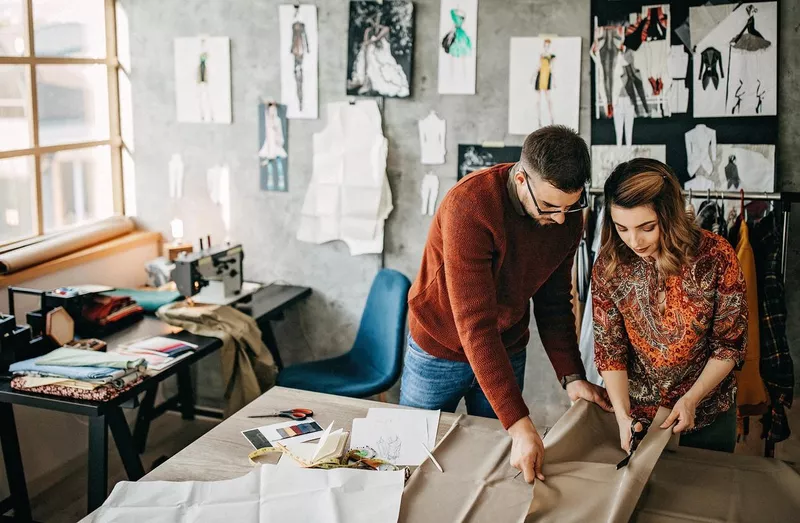 Tailors working in studio together