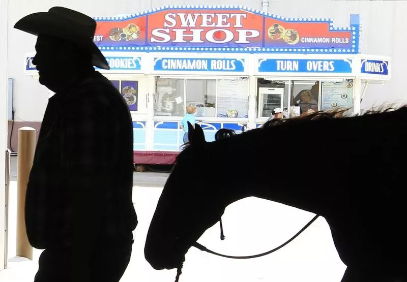 Man with horse at a competition in Oklahoma